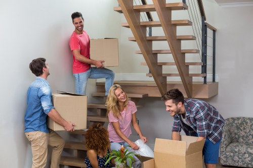 Packed moving boxes and furniture ready for transport