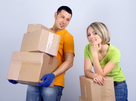 Trained movers handling furniture carefully during a local relocation