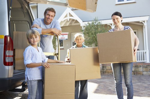 Careful handling of office boxes and equipment during a workplace relocation