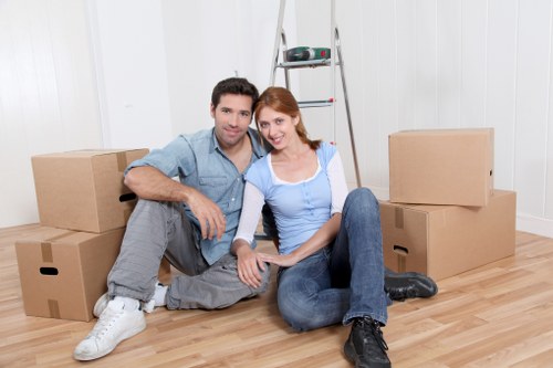 Professional movers handling furniture for a local house move