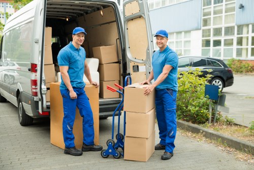Packing and loading household belongings into a removals van