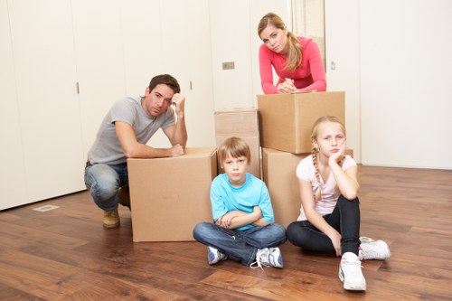 Local removals professionals loading office furniture for transport in Old Coulsdon