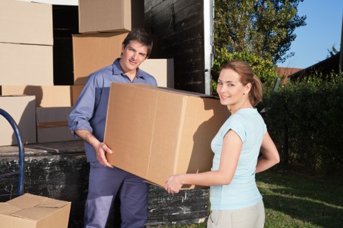 Loading furniture into a removal van on a residential street in Old Coulsdon